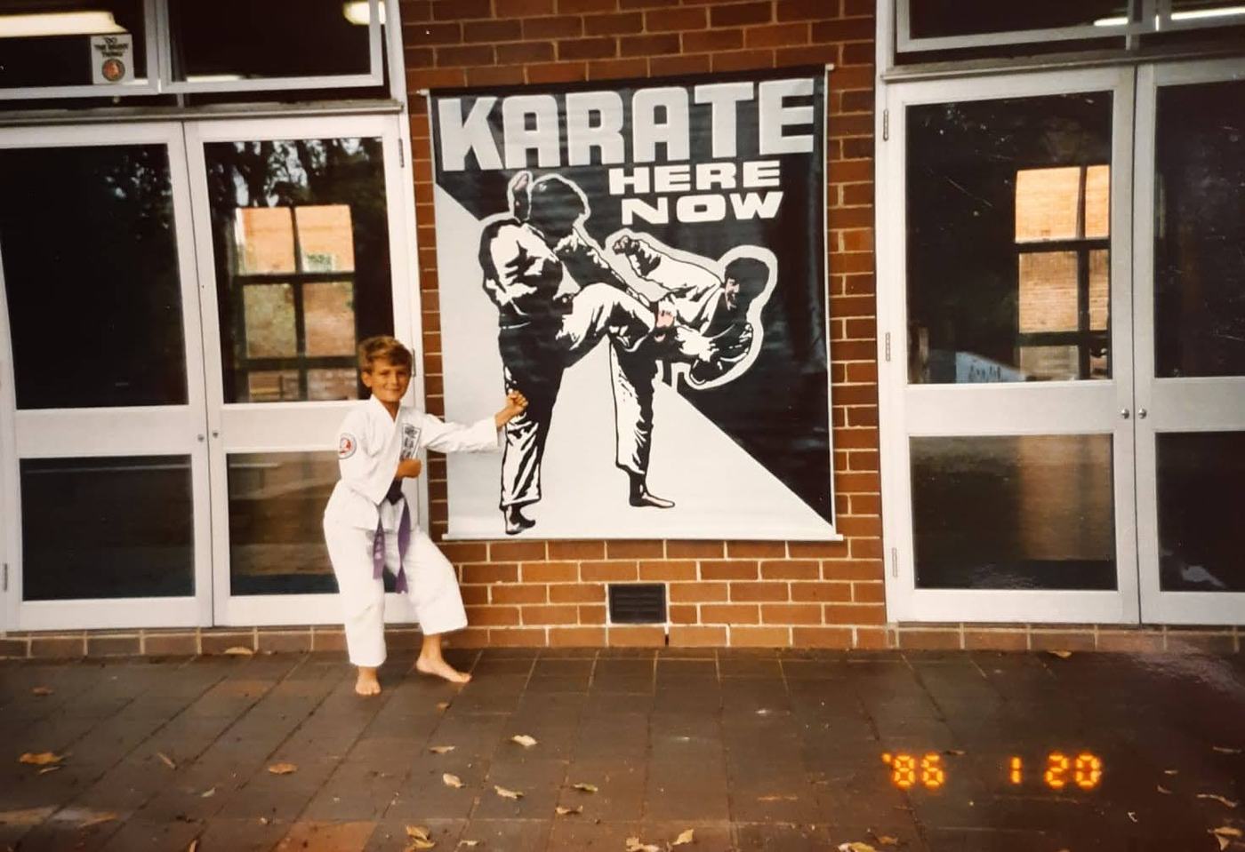 Students in gi posing at the new Roubas dojo in 1986