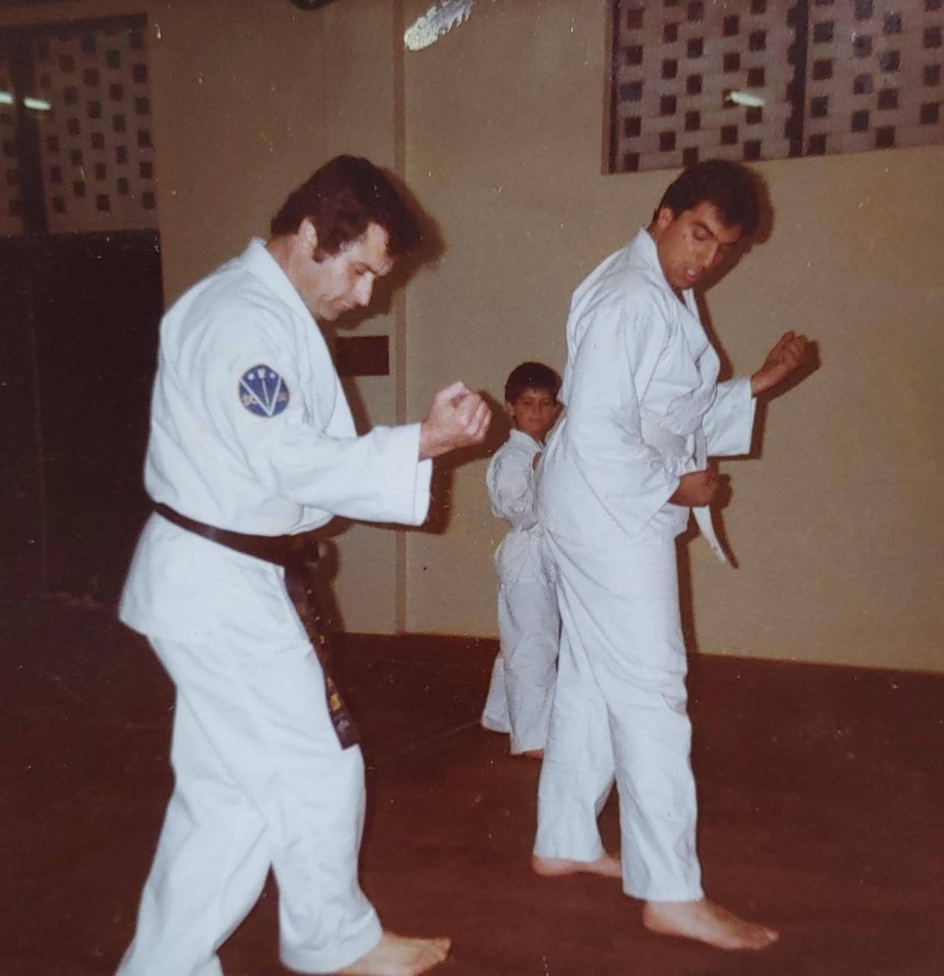 Hanshi Andrew Roubas teaching Sanchin kata to a line of students in 1984